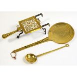 A VICTORIAN BRASS TRIVET, CREAM SKIMMER AND LADLE