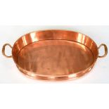 A VICTORIAN COPPER TWO HANDLED DISH, 59CM W
