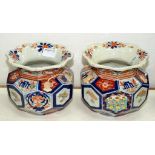 A PAIR OF JAPANESE IMARI SQUAT VASES OF PENTAGONAL AND HEXAGONAL FACETED DESIGN, WITH FLARED NECK,