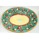 A WEDGWOOD OVAL MAJOLICA DISH, MOULDED WITH TRAILING STRAWBERRIES IN OCHRE RIM, 33CM W, IMPRESSED