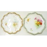 TWO ROYAL DOULTON BONE CHINA DESSERT PLATES, DECORATED WITH NATURALISTIC FLOWERS AND SHAPED PALE