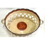 AN OVAL RETICULATED PEARLWARE BASKET, WITH 'ETRUSCAN' DECORATION, TRANSFER PRINTED AND PAINTED IN