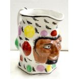 A STAFFORDSHIRE EARTHENWARE TREMAN JUG, SPONGED IN BRIGHT ENAMELS, 14.5CM H, 19TH C