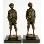 TWO SIMILAR BRONZED STATUETTES OF A WHISTLING BOY, ON MARBLED BASE, 20CM H