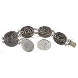 A CHINESE SILVER BRACELET, OF SIX OVAL REPOUSSÉ PANELS OF SCENES, FOLIAGE OR CALLIGRAPHY, 34.5G