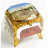 A PALAIS ROYAL GILTMETAL MOUNTED JEWEL CASKET WITH BEVELLED GLASS SIDES, CONTAINING BUTTONED RED