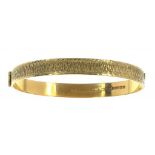 A 9CT GOLD BANGLE, 14.6G