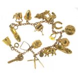 A GOLD CHARM BRACELET, 13G