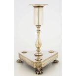 A SOUTH AMERICA SILVER CANDLESTICK, ON SHAPED TRIANGULAR BASE AND THREE PAW FEET, NOZZLE, 18CM H,