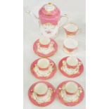 A COALPORT ROSE POMPADOUR GROUND COFFEE SET, DECORATED WITH ROSES, COFFEE POT AND COVER 17.5CM H,