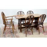 AN OAK DINING TABLE AND A SET OF FIVE CHAIRS