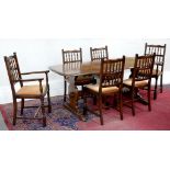 AN OAK DINING TABLE, 80 X 185CM AND A SET OF SIX MAHOGANY DINING CHAIRS, INCLUDING TWO ELBOW CHAIRS