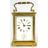 A FRENCH BRASS CARRIAGE CLOCK WITH ENAMEL DIAL AND SUBSIDIARY ALARM DIAL, ORIGINAL PLATFORM LEVER