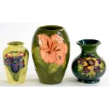 THREE MOORCROFT HIBISCUS, COLUMBINE AND ORCHID PATTERN VASES, LARGEST 13CM H, IMPRESSED MARKS