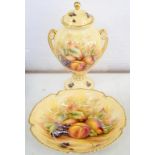 AN AYNSLEY FRUIT DECORATED SHIELD SHAPED VASE AND COVER AND SIMILAR BOWL, VASE AND COVER 23CM H,