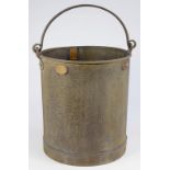 A GALVANISED FIVE GALLON BUCKET, WITH BRASS GRADUATED MEASURE ON THE INSIDE, BRASS "5 GALLON"