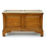 A BLANKET BOX, WITH PANELLED FRONT AND LID, FITTED WITH A TILL, 61CM H, 47 X 102CM