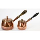 TWO GRADUATED VICTORIAN COPPER SAUCEPANS AND LIDS WITH BALUSTER TURNED WOOD HANDLE, LARGEST 27CM L