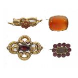 A GEORGIAN FOILED GARNET AND GOLD MOURNING BROOCH, EARLY 19TH C and three other Victorian