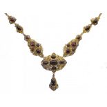 A VICTORIAN FOILED GARNET CABOCHON SET GOLD NECKLACE, C1860 marked on clasp 9ct, 50cm, 50g++Some