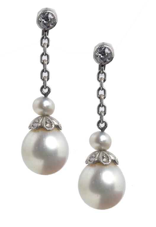 A PAIR OF PEARL AND DIAMOND EARRINGS, EARLY 20TH C the larger pearl suspended from a chain, in white