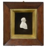 AN ENGLISH OR SCOTTISH IVORY BAS RELIEF PORTRAIT OF A MAN, C1830 bust length, shaped truncation,