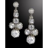 A PAIR OF DIAMOND EARRINGS of seven cushion shaped old cut diamonds, in white gold, fully