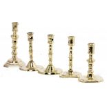FIVE ENGLISH AND CONTINENTAL BRASS CANDLESTICKS, 18TH C on round or octagonal foot, 15-21cm h++All