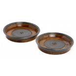 A PAIR OF PEWTER MOUNTED AND TURNED FRUITWOOD WINE COASTERS, EARLY 19TH C with engine turned