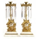 A PAIR OF BRASS PRICKET CANDLESTICKS IN 16TH C STYLE, 19TH/EARLY 20TH C with iron spike, 40 and 41cm