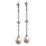 A PAIR OF PEARL AND DIAMOND EARRINGS, MID 20TH C designed as a chain with central diamond and