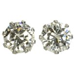 A PAIR OF DIAMOND EAR STUDS each with a round brilliant cut diamond weighing approx 0.7ct, mounted