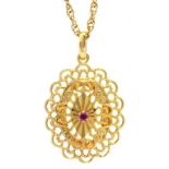 A RUBY SET PIERCED 9CT GOLD OVAL PENDANT AND A GOLD NECKLET MARKED 9CT, 4.1G