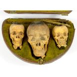 A MACABRE SET OF THREE MEERSCHAUM HUMAN SKULL TOBACCO PIPE BOWLS, LARGEST 5.5CM H, CONTEMPORARY