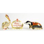 THREE ROYAL CROWN DERBY PAPERWEIGHTS COMPRISING MOONLIGHT BADGER, WHITE PELICAN AND CROWN NAMESTAND,