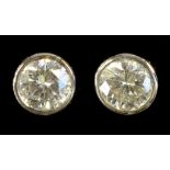 A PAIR OF DIAMOND EAR STUDS, EACH COLLET SET DIAMOND WEIGHING APPROXIMATELY 0.25CT, IN GOLD MARKED