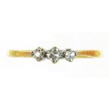 A DIAMOND THREE STONE RING IN GOLD, INDISTINCTLY MARKED 18..., 1.7G