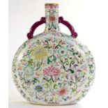 A CHINESE PORCELAIN FAMILLE ROSE MOON FLASK, WITH AUBERGINE HANDLES, ENAMELLED WITH CLASSIC LOTUS