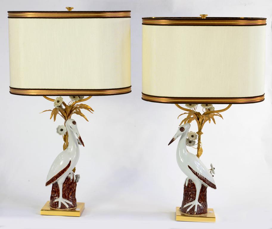 A PAIR OF 18TH C STYLE DECORATIVE GILTMETAL MOUNTED CHINESE PORCELAIN LAMPS INCORPORATING MODELS