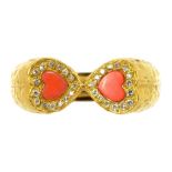 A CORAL AND DIAMOND DOUBLE HEART SHAPED CLUSTER RING, IN TEXTURED GOLD, INDISTINCTLY MARKED, 5.8G
