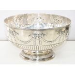 A SILVER PUNCH BOWL, CHASED WITH HUSKS AND BOWS, ON GADROONED FOOT, 32.5CM D, GEORGE III MARKS