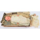 A GERMAN COMPOSITION BABY DOLL, THE MOULDED HEAD WITH WEIGHTED BLUE EYES, OPEN MOUTH WITH TWO