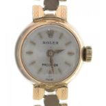 A ROLEX 9CT GOLD PRECISION LADY'S WRISTWATCH AND BRACELET, WITH MAKERS TRADEMARKED CLASP,