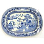 A BLUE PRINTED EARTHENWARE WILLOW PATTERN MEAT DISH, 50CM W, PRINTED CROWN AND CIRCLE D AND CO MARK,