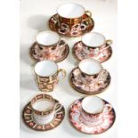 SEVEN ROYAL CROWN DERBY CUPS AND SAUCERS IN VARIOUS IMARI OR JAPAN PATTERNS, ONE COFFEE CUP BROKEN