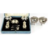 A GEORGE V SILVER FIVE PIECE CONDIMENT SET, PEPPERETTE 7.5CM H, BIRMINGHAM 1929, CASED AND A PAIR OF