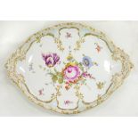 A BERLIN ROCOCO MOULDED PORCELAIN CABARET TRAY, BOLDLY PAINTED WITH A CENTRAL FLORAL SPRAY AND