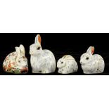 FOUR ROYAL CROWN DERBY PAPERWEIGHTS, COMPRISING MEADOW RABBIT, SNOWY RABBIT AND TWO OTHERS (