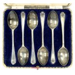 A SET OF SIX GEORGE V SILVER GOLFING PRIZE COFFEE SPOONS, SHEFFIELD 1932 AND 1933, CASED, 2OZS 10