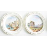 A PAIR OF MINTON PIERCED EARTHENWARE PLATES, OUTSIDE DECORATED, PAINTED WITH LANDSCAPES, 22.5CM D,